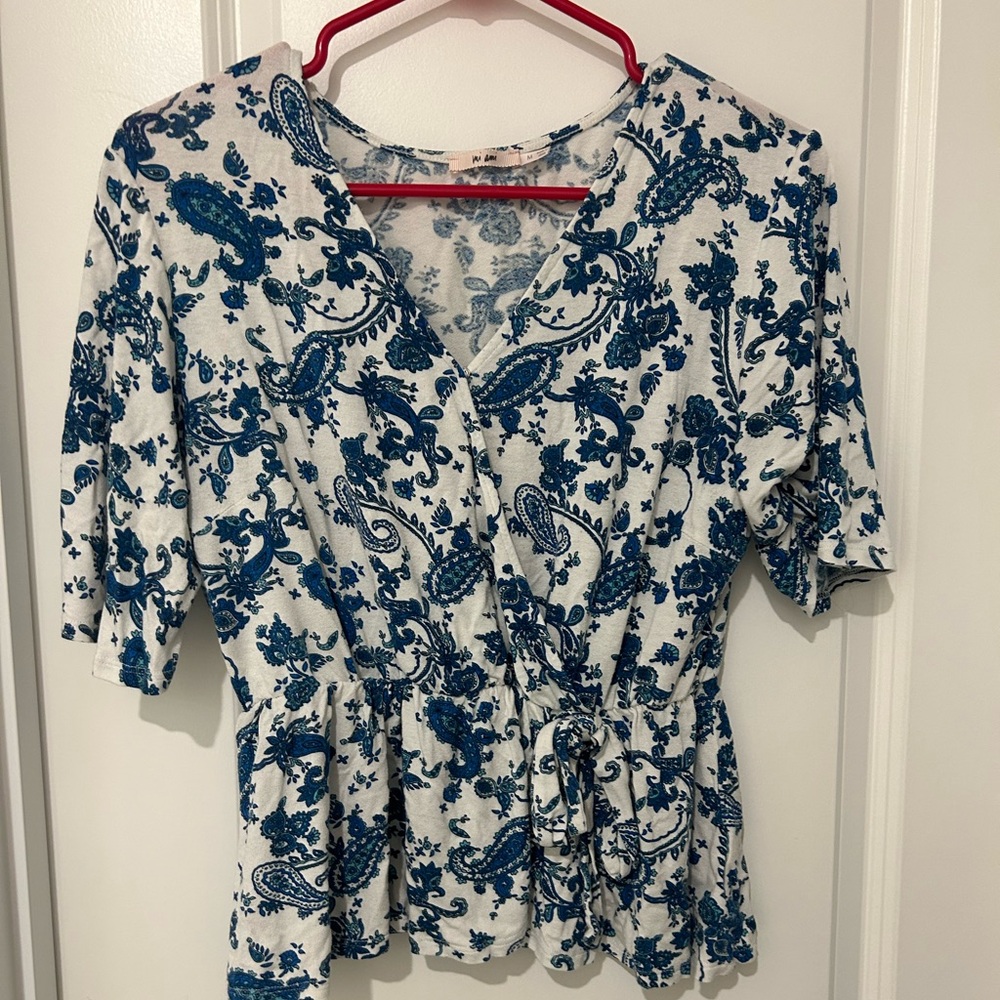 Francesca’s blue and white tie shirt